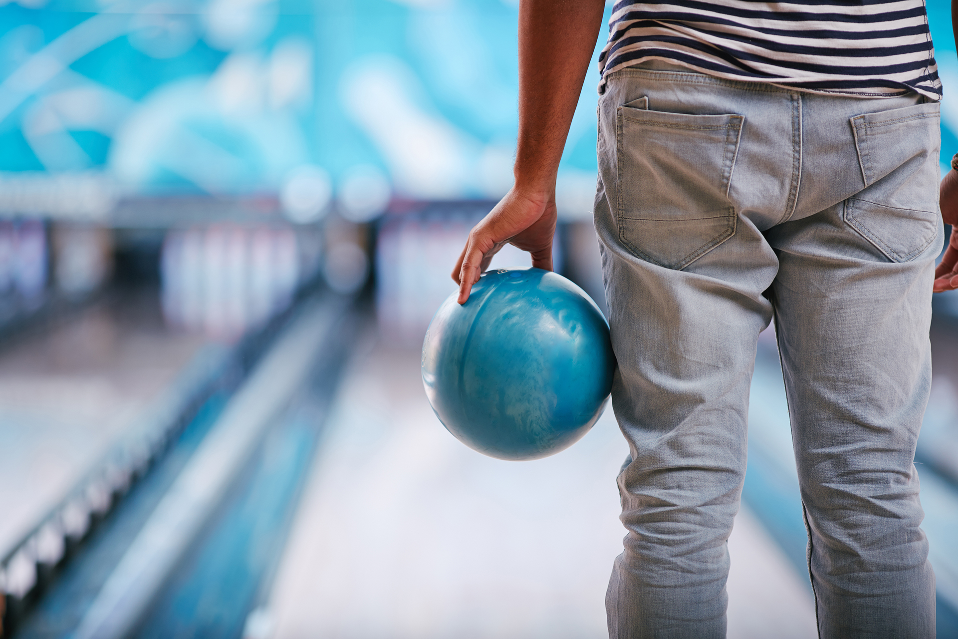 Close-up of man holding a bowling ball